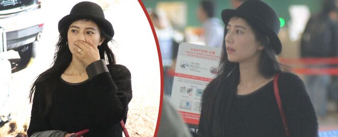 高圆圆现身婚戒抢眼 着黑衣显低调亲自办托运